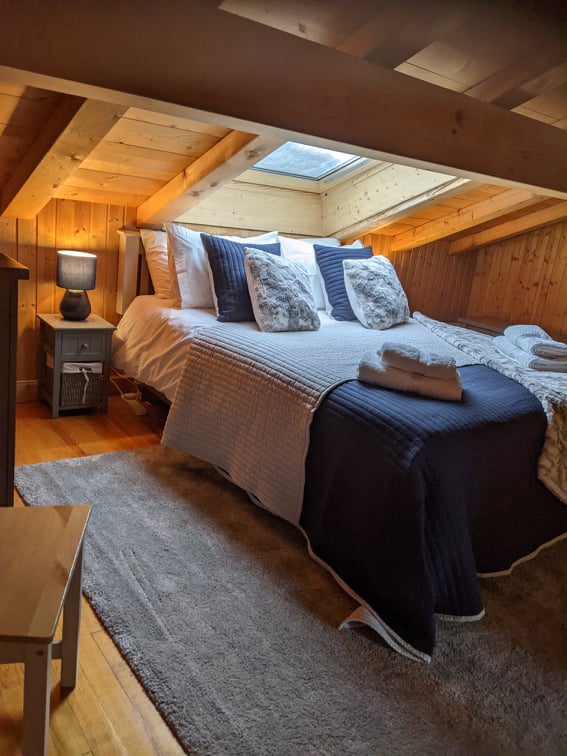 This eaves room offers either a super-kingsize bed or 3 separate single beds b